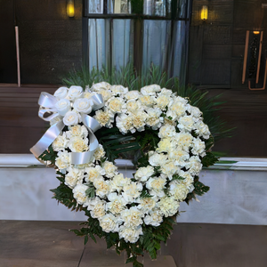 Open heart of cream carnations with roses